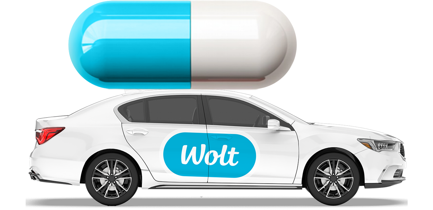 En bil med Wolt logga på dörren 